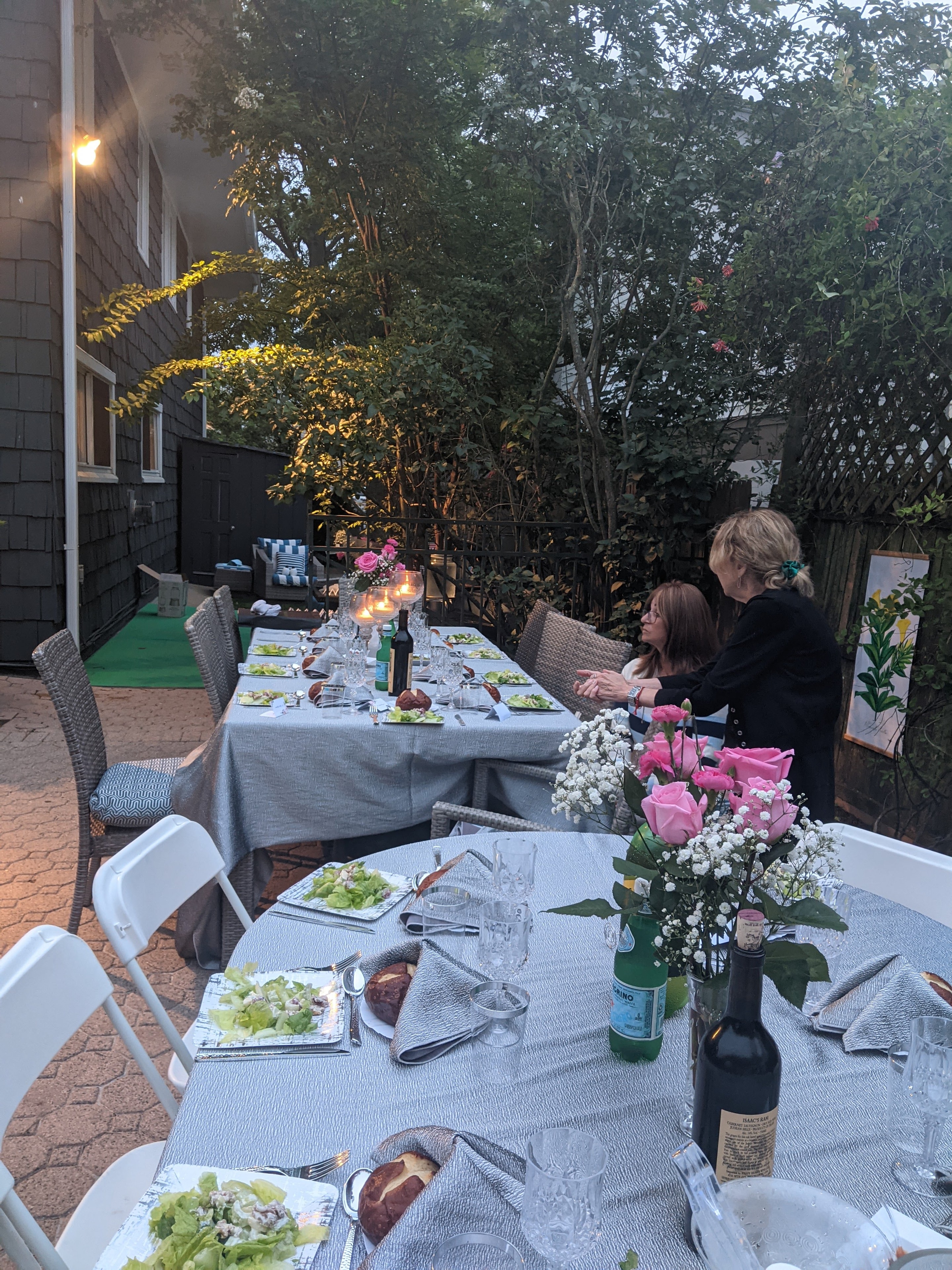 Long dinner table set in the backyard at the 2021 Arizal Siyum