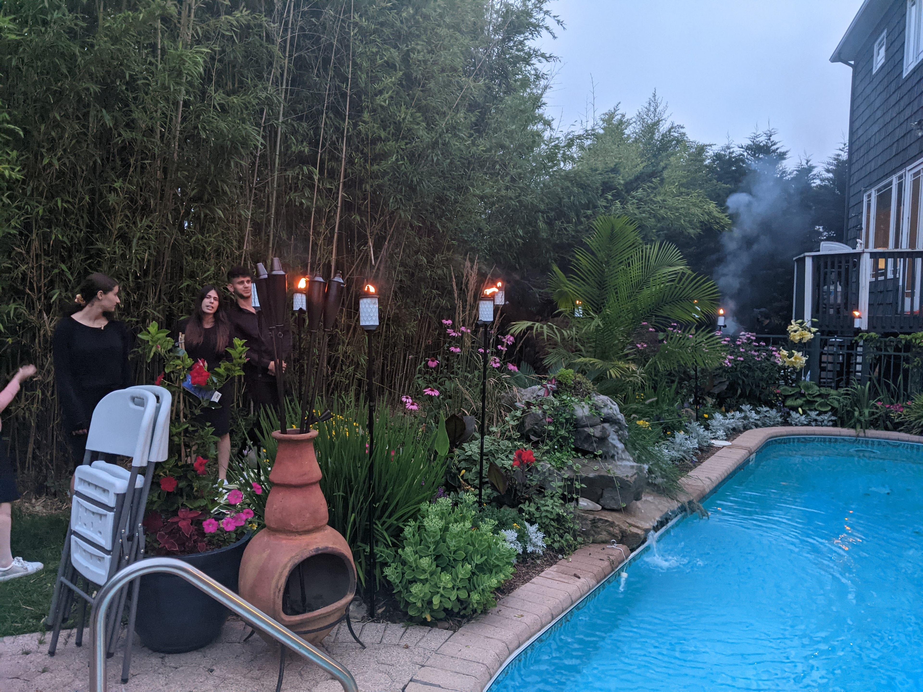 Garden and pool area with tiki torches at the 2021 Arizal Siyum venue