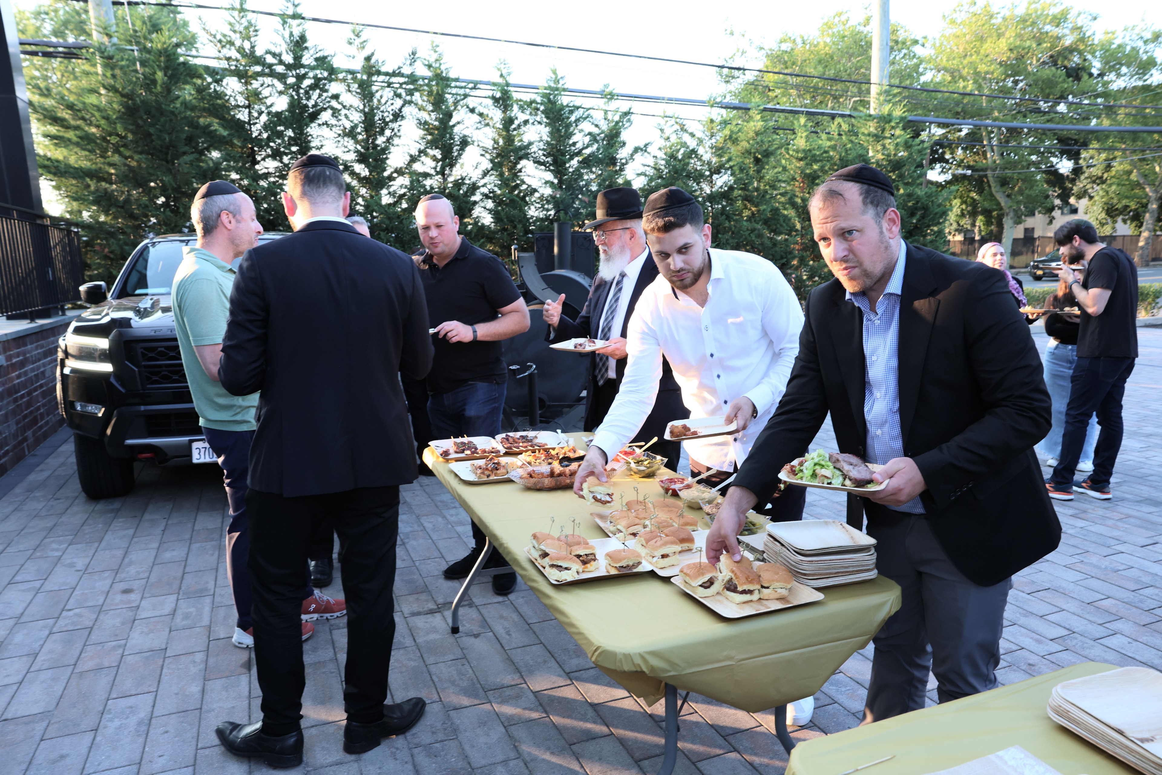 Guests at the outdoor BBQ at the 2026 Arizal Siyum & BBQ Dinner